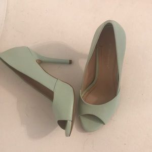 Once worn mint green pumps.